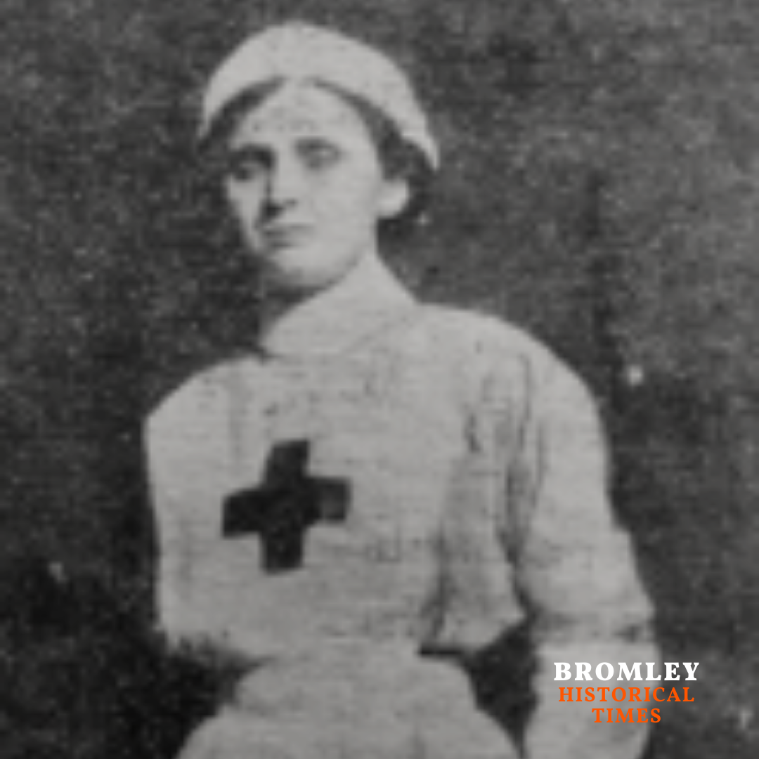 Portrait of nurse Margaret Birkett standing in uniform