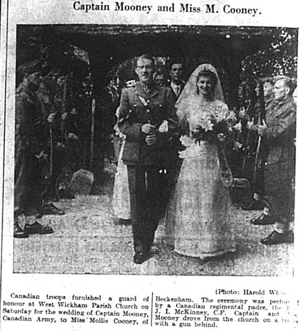 Wedding photograph of Captain John Mooney and Miss Mollie Cooney outside West Wickham Parish Church in July 1941