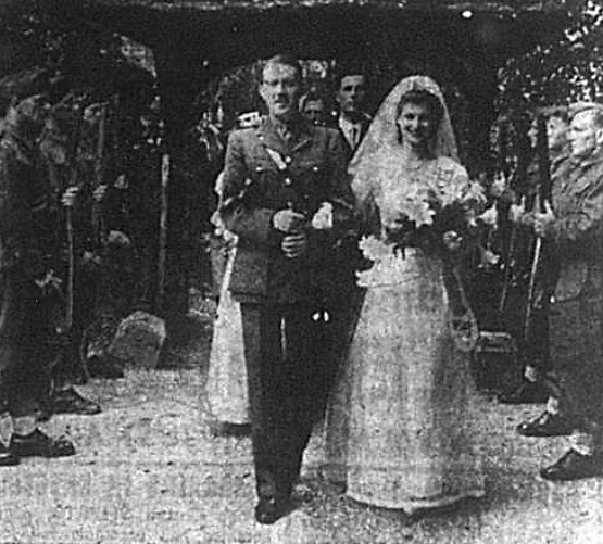 Wedding photograph of Captain John Mooney and Miss Mollie Cooney outside West Wickham Parish Church in July 1941