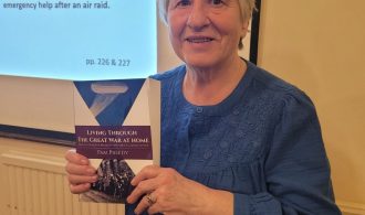 Pam Preedy holding a copy of her new book Living Through The Great War at Home: How the People of Bromley Faced the Challenges of War